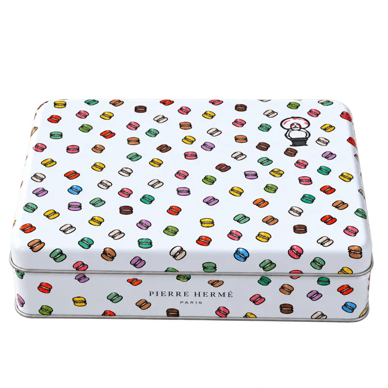 イラストをあしらったピエール・エルメ・パリのサブレ詰合わせの缶のパッケージ
